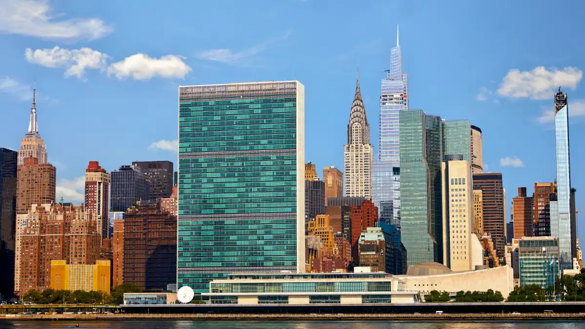 The United Nations Secretariat Building on Manhattan’s East River, with the Chrysler Building and the Midtown skyline behind it